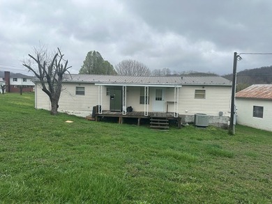 4 bedroom, 2 bath doublewide constructed in 2001. Roof has been - photo 3