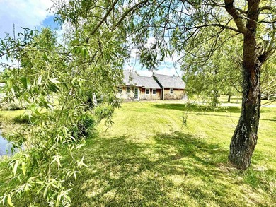 Nestled on a breathtaking 5.19 +/- acre parcel, this unique - photo 1
