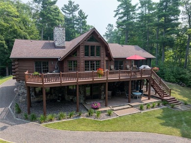 Tucked in the Southern cove of Red Cedar Lake, this 4 bedroom, 3 - photo 1