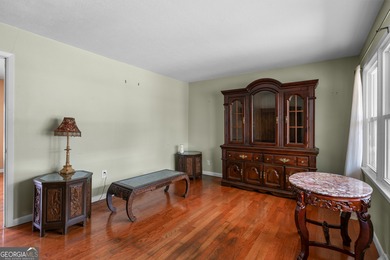 This four-sided brick, one-level home offers 3 bedrooms and 1.5