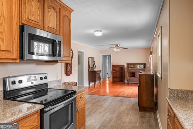 This four-sided brick, one-level home offers 3 bedrooms and 1.5