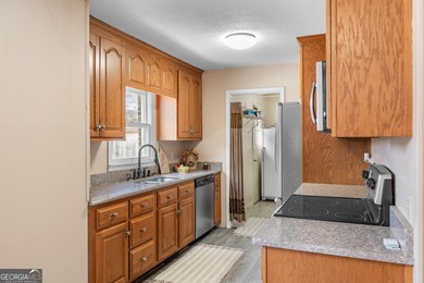 This four-sided brick, one-level home offers 3 bedrooms and 1.5