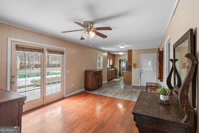 This four-sided brick, one-level home offers 3 bedrooms and 1.5