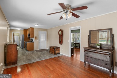 This four-sided brick, one-level home offers 3 bedrooms and 1.5