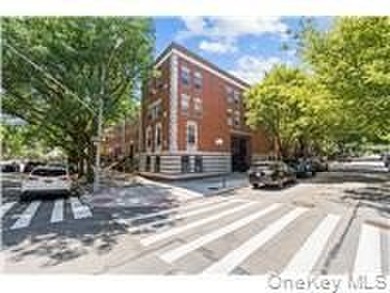 Updated three-bedroom duplex in the heart of Harlem, featuring - photo 1