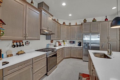 This stunning corner-lot home offers breathtaking lake views and - photo 15