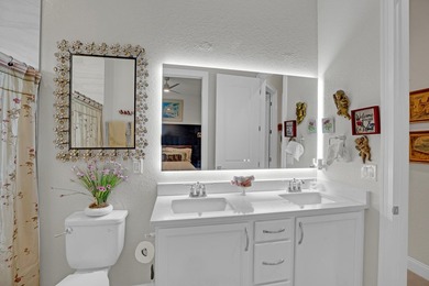 This stunning corner-lot home offers breathtaking lake views and - photo 25