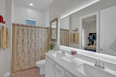 This stunning corner-lot home offers breathtaking lake views and - photo 26