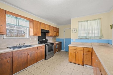 Nestled in a quiet, established neighborhood, this classic