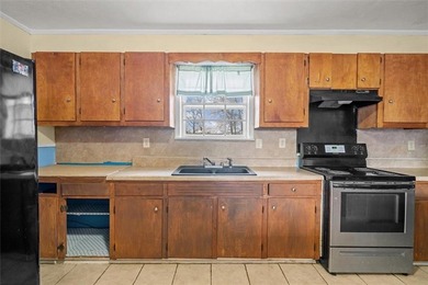 Nestled in a quiet, established neighborhood, this classic