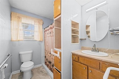 Nestled in a quiet, established neighborhood, this classic