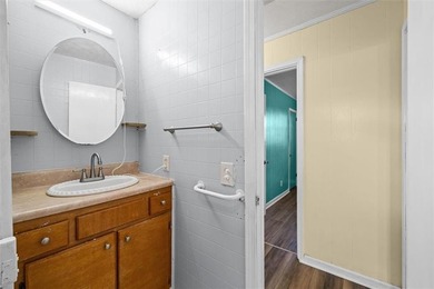 Nestled in a quiet, established neighborhood, this classic