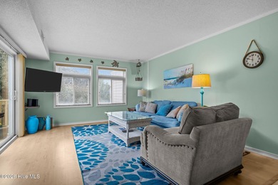 Experience the best of both worlds with this soundside condo
