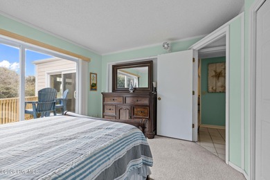 Experience the best of both worlds with this soundside condo