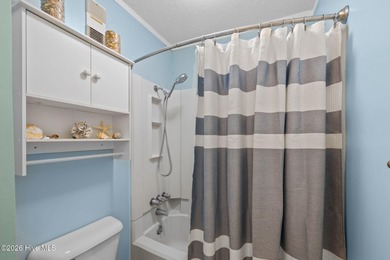 Experience the best of both worlds with this soundside condo