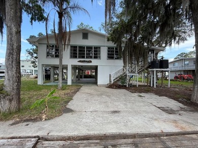 Waterfront paradise with incredible potential! This elevated - photo 1