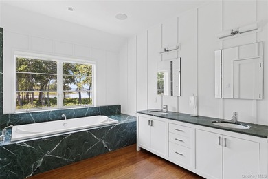 Set on the tranquil shores of Genet Creek, this modern - photo 18