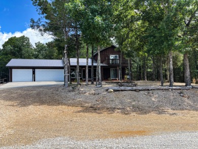 This 3 bedroom, 3 bath home sits on 6 lots in Country Club Hills - Lake Home For Sale in Theodosia, Missouri