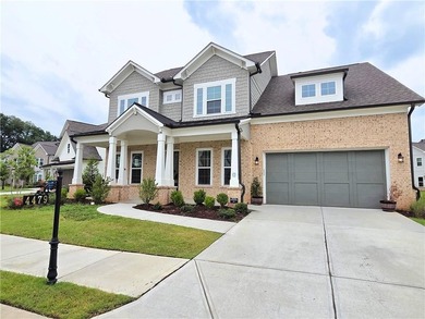 Like-new West-facing Ashton Woods home 4 bedrooms | 4 bathrooms - photo 1
