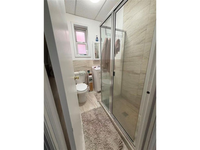 Well-maintained 1-story brick 2-family home. The property - photo 9