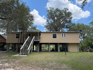 Wake up to breathtaking views of the Suwannee River from this - photo 1