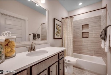 The Fullerton is a two-story Craftsman-style home offering three - photo 17