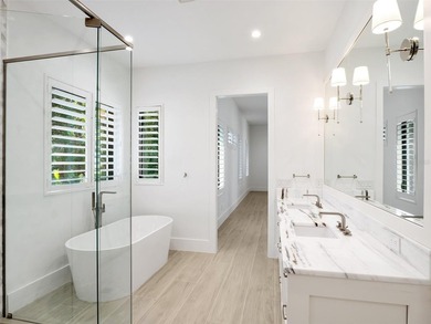Set within the gates of renowned Isleworth, this beautifully - photo 21