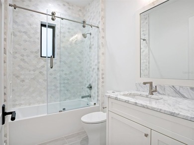 Set within the gates of renowned Isleworth, this beautifully - photo 29