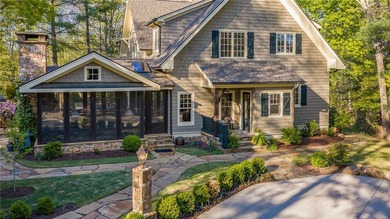 This Adirondack-inspired home is gracefully set atop a wooded - photo 3