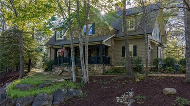 This Adirondack-inspired home is gracefully set atop a wooded - photo 4