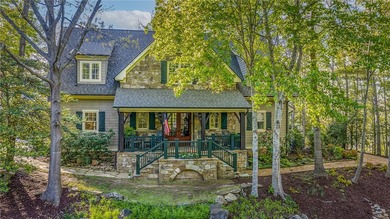 This Adirondack-inspired home is gracefully set atop a wooded - photo 5