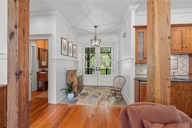 This Adirondack-inspired home is gracefully set atop a wooded - photo 6