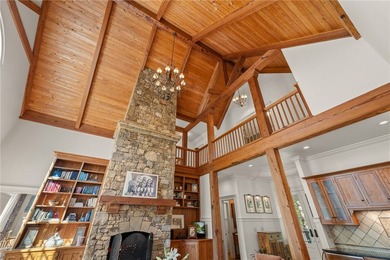 This Adirondack-inspired home is gracefully set atop a wooded - photo 9