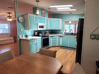 THIS HOME IS ON LEASED LAND WITH A MONTHLY LOT RENT OF $620 AND - photo 32