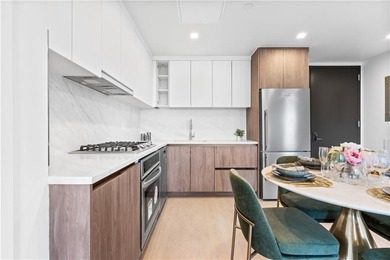 Residence 19H at Bayview Courtyard offers elevated living in a - photo 5