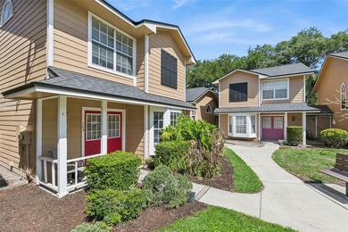 Welcome to this charming townhouse-style condominium located in - photo 2