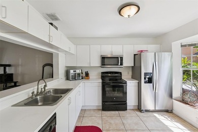 Welcome to this charming townhouse-style condominium located in - photo 7