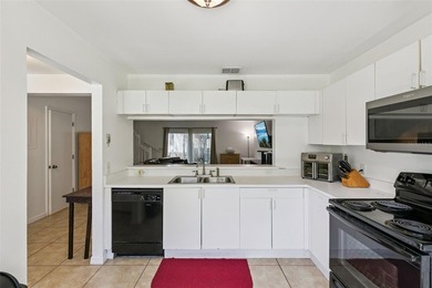 Welcome to this charming townhouse-style condominium located in - photo 9