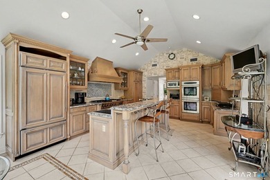 Tucked away on a quiet, tree-lined street in North Stamford - photo 11