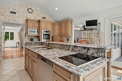 Tucked away on a quiet, tree-lined street in North Stamford - photo 12