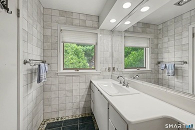 Tucked away on a quiet, tree-lined street in North Stamford - photo 20