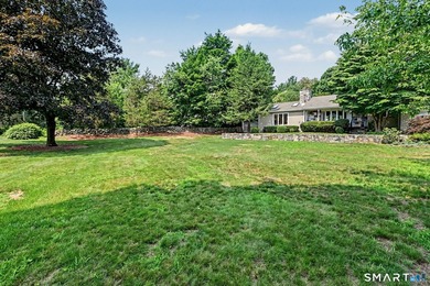 Tucked away on a quiet, tree-lined street in North Stamford - photo 32