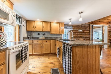 Tucked away on a peaceful private road, this heavenly log home - photo 24