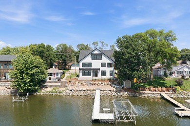 Experience exceptional lakefront living on the highly - photo 2