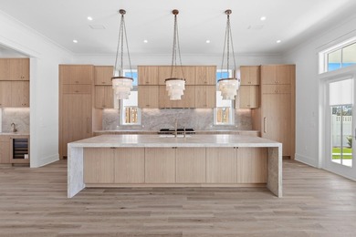The Darien III by Romair is a custom residence with a detached - photo 6