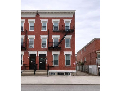 Welcome to this fully renovated 6-family brick property located - photo 1