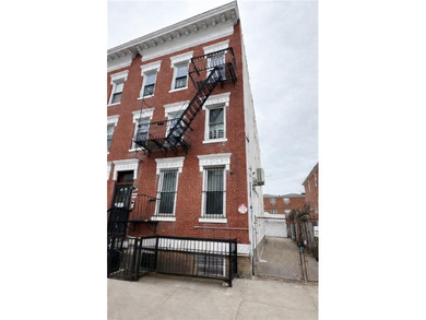 Welcome to this fully renovated 6-family brick property located - photo 3