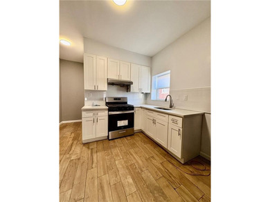 Welcome to this fully renovated 6-family brick property located - photo 5
