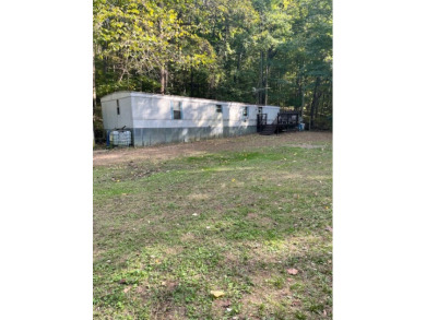 HUNTING ACREAGE WITH COMFORTABLE 2 BED HOME! - Lake Home For Sale in Battletown, Kentucky