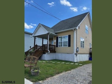 Welcome home with a front porch made for morning coffee or an
